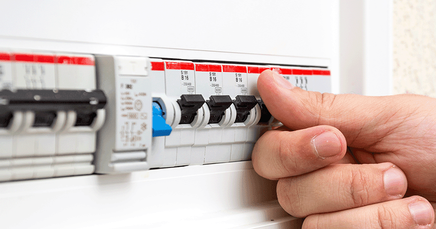 Electrician diagnosing power trip issue